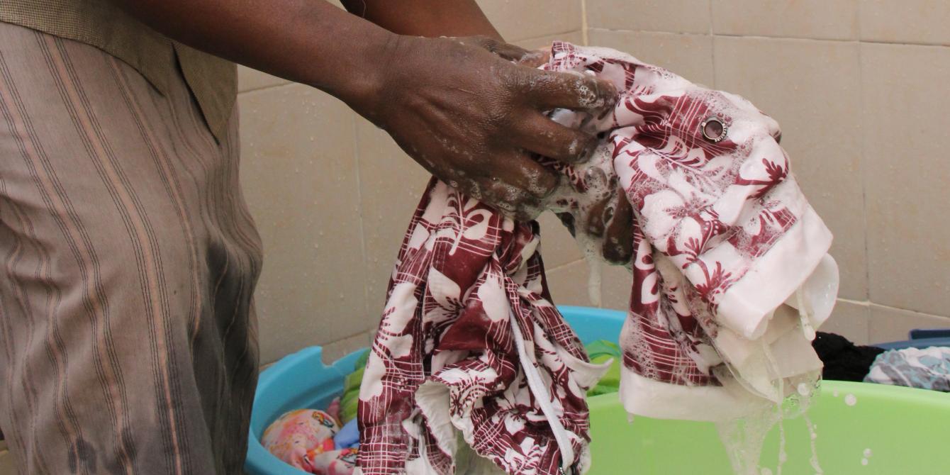 A domestic care worker cleaning clothes in Nairobi, Kenya. Photo Credit: Benson Guantai A domestic care worker cleaning clothes in Nairobi, Kenya. Photo Credit: Benson Guantai